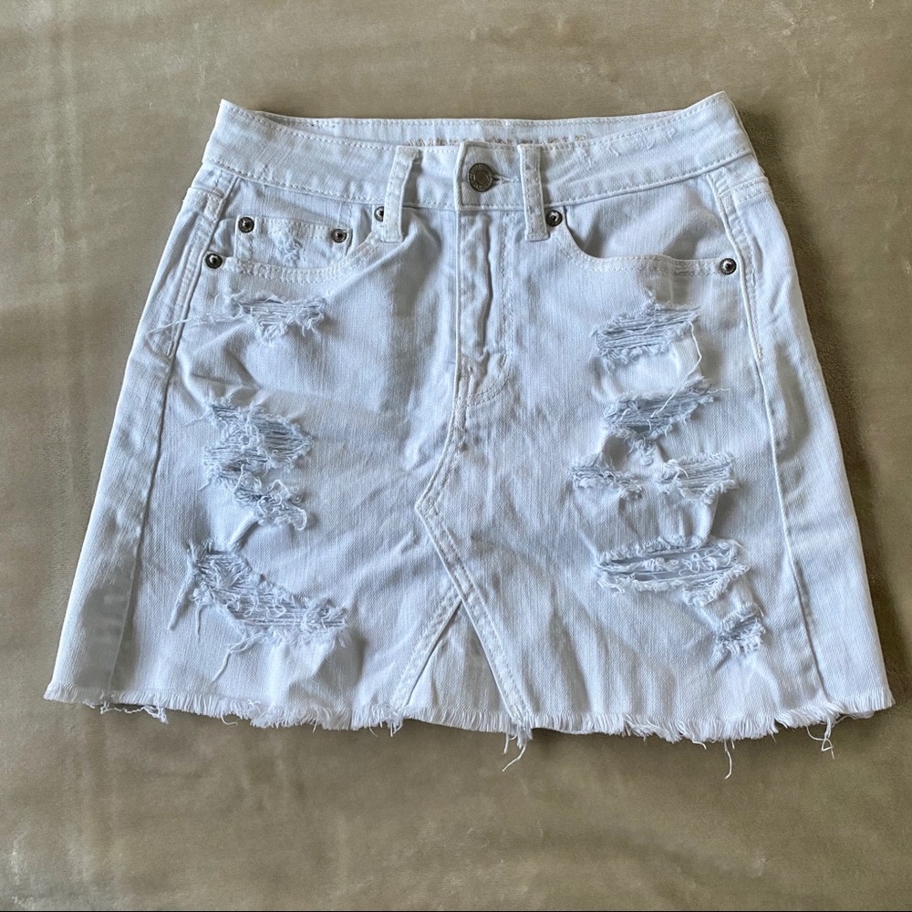White ripped denim skirt